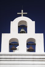 USA, Arizona, Tucson, Mission Church of San Xavier del Bac. White painted bell tower with three