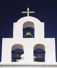 USA, Arizona, Tucson, Mission Church of San Xavier del Bac. White painted bell tower with three