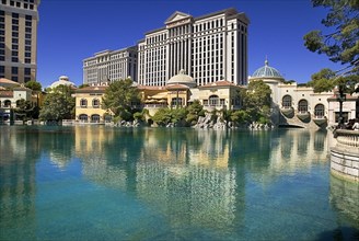 USA, Nevada, Las Vegas, The Strip view across the pool outside the Bellagio toward Caesars Palace