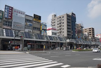 Japan, Honshu, Tokyo, Sugamo. The roof of arcade covering sidewalk used for solar electric and