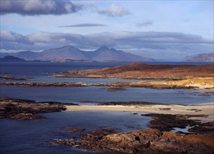 Scotland, Highlands, Ardnamurchan, Sanna Bay with the Isle of Rum beyond. 
Photo : Bryan Pickering