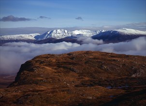 Scotland, Highlands, West, Ben More Forest and snow covered Assynt Mountains 998 metres at highest