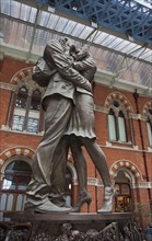 England, London, St Pancras railway station on Euston Road The Meeting Place statue by Paul Day.