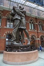 England, London, St Pancras railway station on Euston Road The Meeting Place statue by Paul Day.