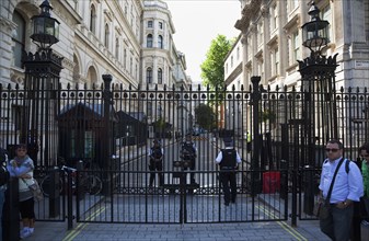 England, London, Westminster Whitehall Downing Street Security gates and armed police guards.