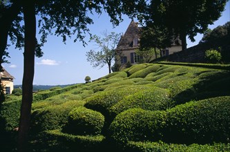 France, Aquitaine, Dordogne, Chateau de Marqueyssac near Vezac. Exterior and gardens with clipped