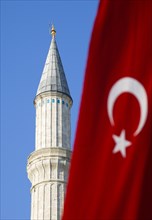 Turkey, Istanbul, Sultanahmet Haghia Sophia minaret and Turkish red flag with white crescent moon