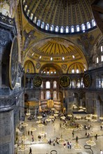 Turkey, Istanbul, Sultanahmet Haghia Sophia The nave with tourists sightseeing below the dome and