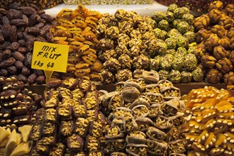 Turkey, Istanbul, Eminonu Misir Carsisi Spice Market interior. Mixed fruit and nuts. 
Photo :