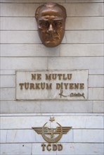 Turkey, Istanbul, Sirkeci Gar railway station interior bronze plaque of Ataturk. 
Photo : Stephen