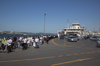 Turkey, Istanbul, Sirkeci ferry terminal with cars and passengers disembarking. 
Photo : Stephen