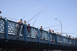Turkey, Istanbul, Galata Bridge people fishing. 
Photo : Stephen Rafferty