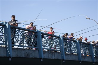 Turkey, Istanbul, Galata Bridge people fishing. 
Photo : Stephen Rafferty
