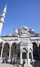 Turkey, Istanbul, Eminonu Yeni Camii New Mosque worshippers washing feet in courtyard. 
Photo :