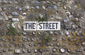 Communications, Signage, Street name embedded in flint wall. 
Photo : Stephen Rafferty