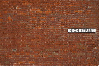 Cummunications, Signage, High Street sign in red brick wall. 
Photo : Stephen Rafferty