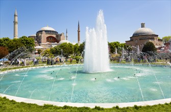 Turkey, Istanbul, Sultanahmet Haghia Sophia with dome and minarets beyond the water fountain and