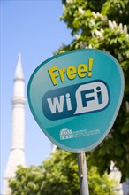 Turkey, Istanbul, Sultanahmet Haghia Sophia minaret behind sign for Free Wifi hotspot. 
Photo :