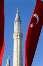 Turkey, Istanbul, Sultanahmet Haghia Sophia minaret and Turkish red flag with white crescent moon