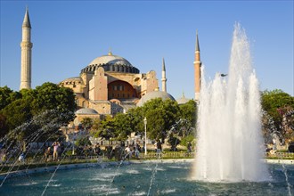 Turkey, Istanbul, Sultanahmet Haghia Sophia with dome and minarets beyond the water fountain in the