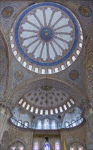 Turkey, Istanbul, Sultanahmet Camii The Blue Mosque interior with decorated painted domes. 
Photo