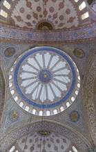 Turkey, Istanbul, Sultanahmet Camii The Blue Mosque interior with decorated painted domes. 
Photo