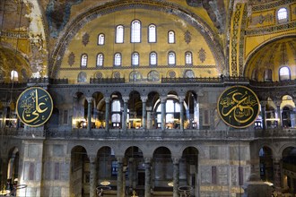 Turkey, Istanbul, Sultanahmet Haghia Sophia Sightseeing tourists in the North Gallery with Koranic
