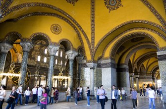 Turkey, Istanbul, Sultanahmet Haghia Sophia Tourists in the vaulted decorative North Gallery.