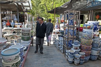 China, Jiangsu, Yangzhou, Ceramic pots for plants and decorative use in downtown canal-side street