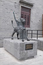 China, Jiangsu, Yangzhou, Bronze lion sculpture outside the Marco Polo Museum. The sculpture is a
