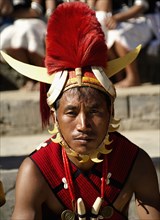 PORTRAIT OF A TRIBAL FROM A NAGA WARRIOR TRIBE WEARING TRADITIONAL COSTUME AND JEWELRY, NAGALAND, NORTH EAST INDIA