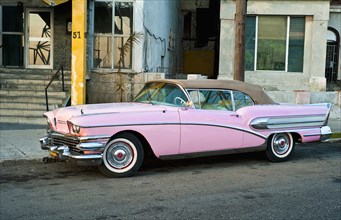 Cuba, Havana, Pink Buick convertile with the roof raised. 
Photo : Richard Rickard