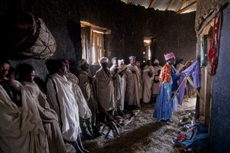 Ethiopia, Religion, Christianity, Service inside rural mud built rural Christian church. 
Photo :