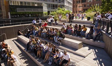 USA, New York, Manhattan, West Side High Line Park 10th Avenue Square Theater area with high school