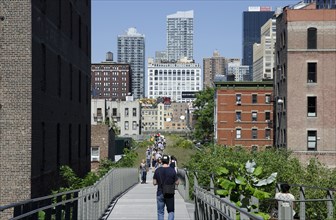 USA, New York, Manhattan, West Side the Highline Park north of 23th Street with people strolling.