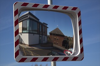 Transport, Road, Safety, Convex mirror used to view oncoming traffic from unsighted exit. 
Photo :