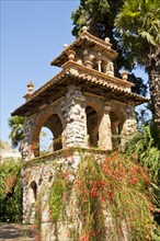 Italy, Sicily, Taormina, Via Bagnoli Croce Villa Comunale A building in Trevelyan Public Gardens.