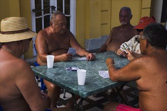 Pest Male bathers playing cards in summer at Szechenyi thermal baths largest in Europe.