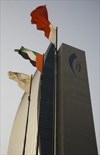 National Bank of Dubai building with flags overlooking the Creek.