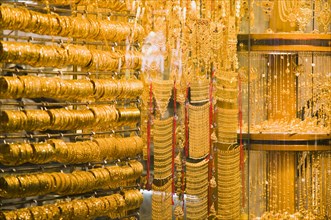 Gold bangles and jewellery in window display of Gold Souk Deira.