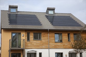 Graylingwell Park Modern housing with solar panels blended seamlessly in to roof tiles.