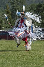 Blackfoot dancer in the Fancy Dance at the Blackfoot Arts & Heritage Festival Pow Wow organized by Parks Canada and the Blackfoot Canadian Cultural Society at this UNESCO World Heritage Site.