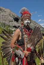 Blackfoot head dancer Aryson Black Plume in full regalia and face paint at the Blackfoot Arts & Heritage Festival Pow Wow organized by Parks Canada and the Blackfoot Canadian Cultural Society Headdres...