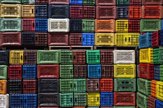 Geometrical colorful plastic crates forming a pattern.