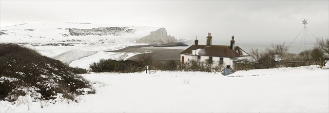 Seven Sisters Snow covered chalk cliffs viewed from the coastguard cottages at Cuckmere Haven.