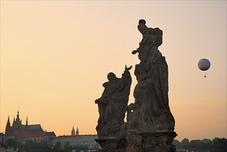 Charles Bridge Statue of the Madonna attending to St. Bernard with St Vitus in distance.