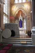 Falls Road Clonard Monastery interior decorated for Good Friday with statues draped in purple cloth.