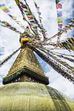 Boudhanath Stupa near Kathmandu, with coloutful prayer flags.