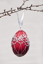 Hand-painted egg shell hanging from a branch to celebrate Easter at the Old Vienna Easter Market at the Freyung.