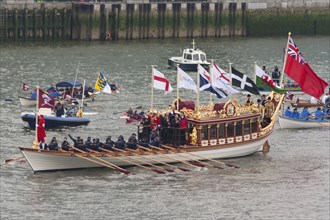 Rowers aboard Gloriana proceed along River Thames as part of the Queens Thames Diamond Jubilee Pageant taken from Tower Bridge 3rd June 2012.